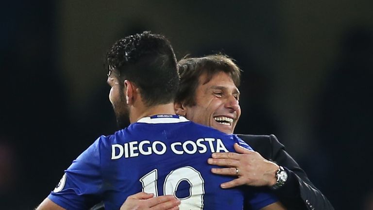 Antonio Conte embraces Chelsea striker Diego Costa