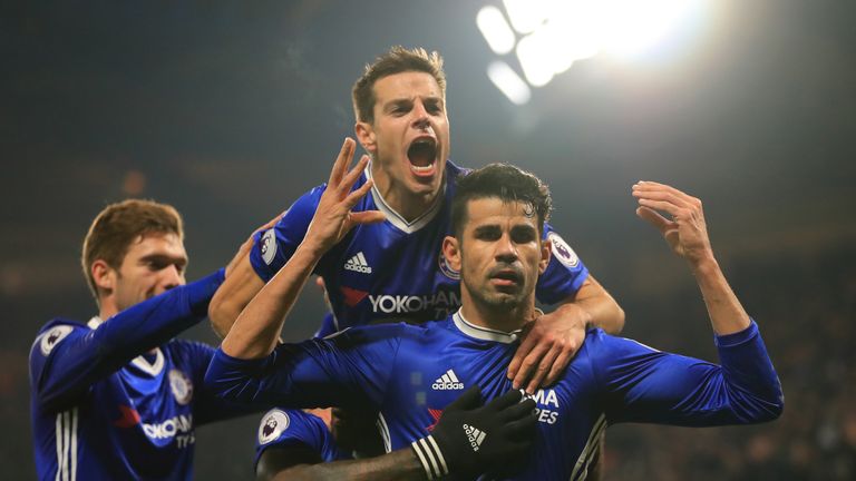 LONDON, ENGLAND - JANUARY 22:  Diego Costa (R) of Chelsea celebrates scoring the opening goal with his team mates during the Premier League match between C