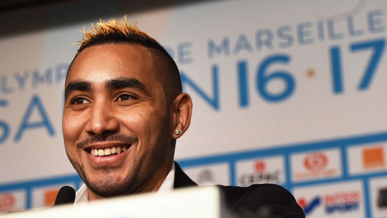 Dimitri Payet smiles during a press conference at Olympique de Marseille's training ground