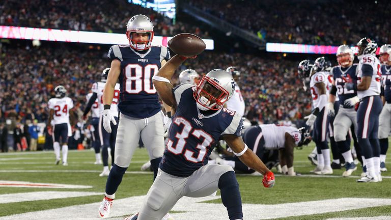 FOXBORO, MA - JANUARY 14:  Dion Lewis #33 of the New England Patriots celebrates after scoring a touchdown in the fourth quarter against the Houston Texans