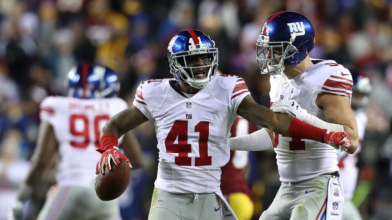 LANDOVER, MD - JANUARY 01: Cornerback Dominique Rodgers-Cromartie #41 of the New York Giants celebrates with teammate outside linebacker Mark Herzlich #94 