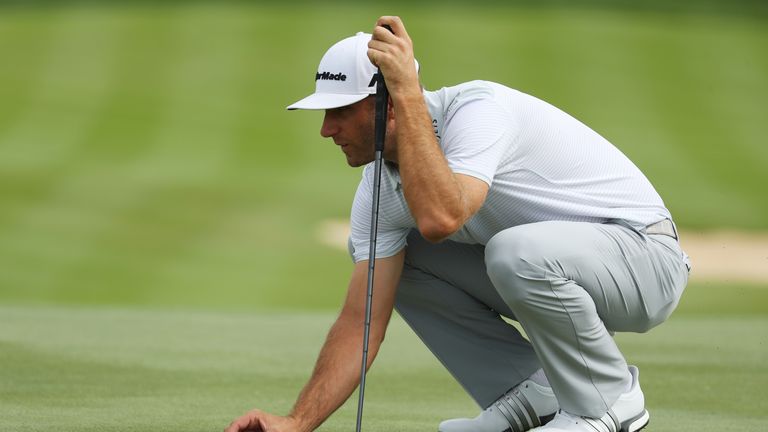 ABU DHABI, UNITED ARAB EMIRATES - JANUARY 22: Dustin Johnson of the United States lines up a putt on the 4th green during the final round of the Abu Dhabi 