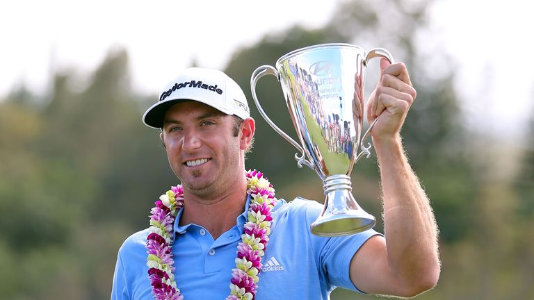 KAPALUA, HI - JANUARY 08:  Dustin Johnson celebrates with the Hyundai Tournament of Champions Cup after winning in the final round at the Plantation Course