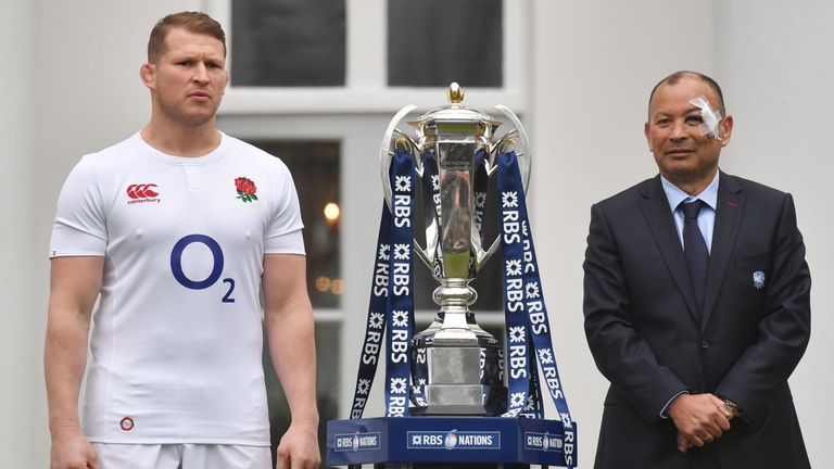 England rugby captain Dylan Hartley (L) and England's Australian coach, Eddie Jones pose with the trophy at the official launch of the 2017 Six Nations Int