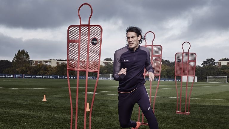 Edinson Cavani runs through a drill in Nike Football's training gear