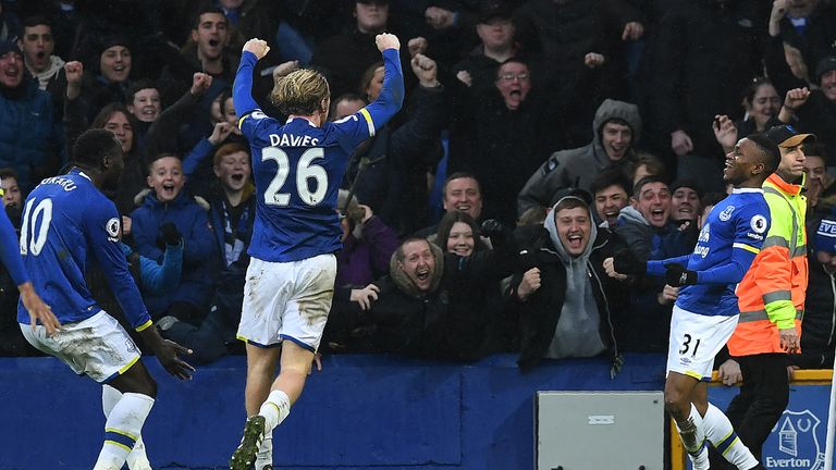 Everton's English forward Ademola Lookman (R) celebrates scoring his team's fourth goal during the English Premier League football match between Everton an