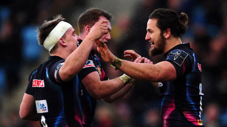 Michele Campagnaro of Exeter Chiefs(R) celebrates his sides try during the Anglo-Welsh Cup match between Exeter Chiefs