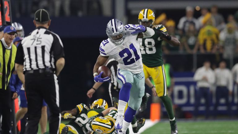ARLINGTON, TX - JANUARY 15:  Ezekiel Elliott #21 of the Dallas Cowboys carries the ball during the fourth quarter against the Green Bay Packers in the NFC 