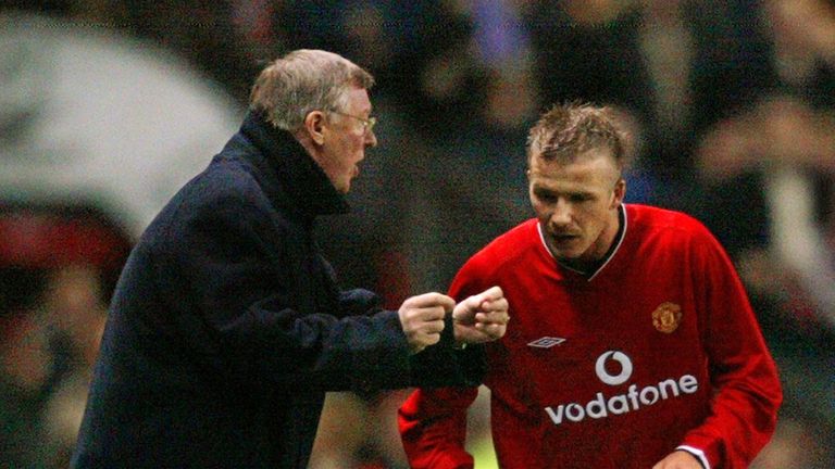 (FILES) A picture taken on February 26, 2002 shows Manchester United's manager Sir Alex Ferguson (L) giving instructions to David Beckham during a champion