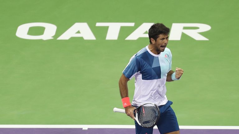 Spain's Fernando Verdasco reacts after winning a point against Serbia's Novak Djokovic during their semi-final tennis match of the ATP Qatar Open in Doha o