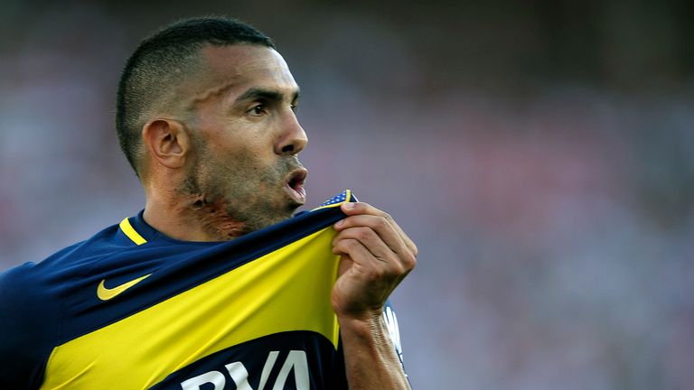 Carlos Tevez celebrates his goal against River Plate while playing for rivals Boca Juniors