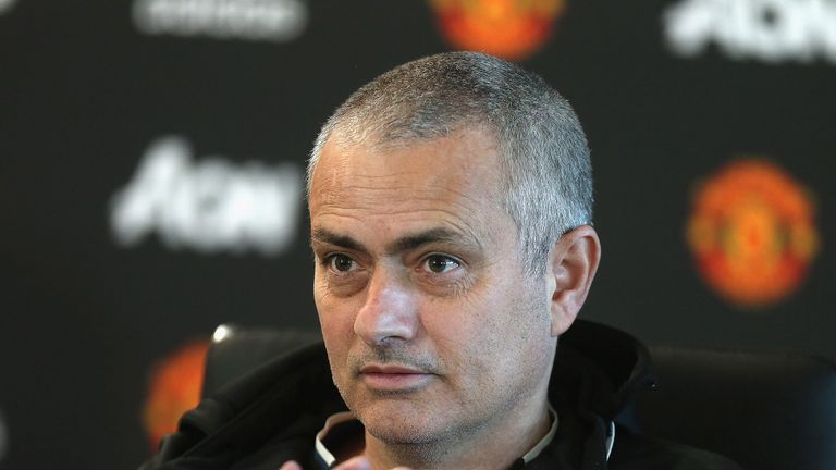 Jose Mourinho, sporting a new haircut, speaks during a press conference at Aon Training Complex