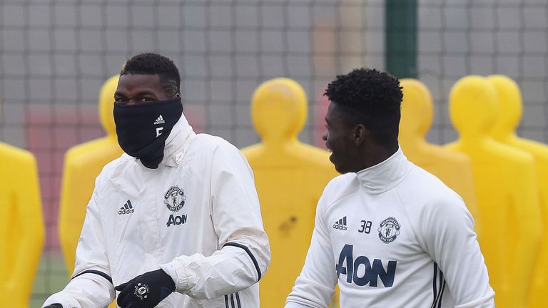 Paul Pogba and Axel Tuanzebe during a first team training session at Aon Training Complex