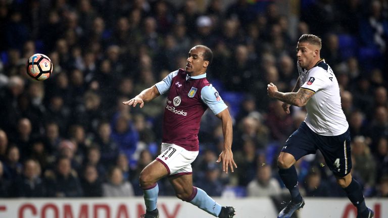 Gabriel Agbonlahor (L) and Toby Alderweireld battle for the ball