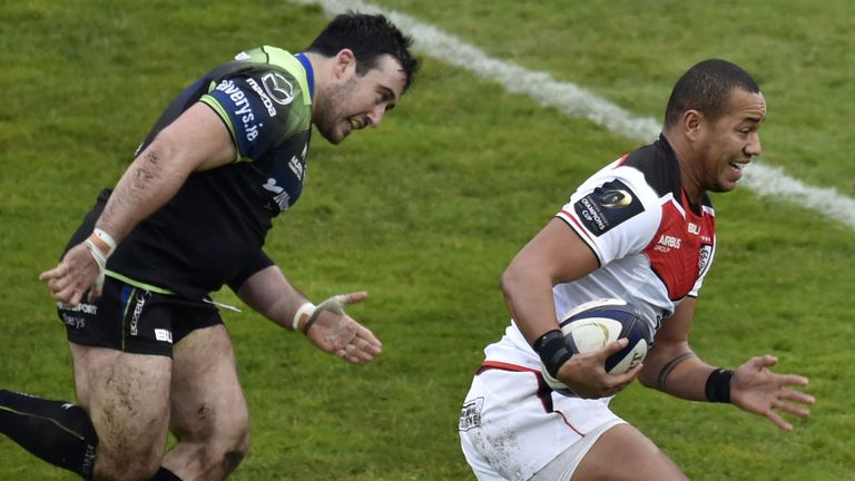 Toulouse's French centre Gael Fickou runs with the ball past Connacht Rugby's Irish prop Denis Buckley during the European Rugby Champions Cup rugby union 