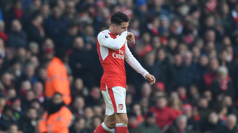 Granit Xhaka of Arsenal walks off the pitch after being shown a red card 