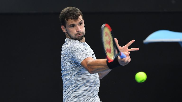 Grigor Dimitrov of Bulgaria plays a forehand in his fourth round match against Denis Istomin of Uzbekistan on day eight