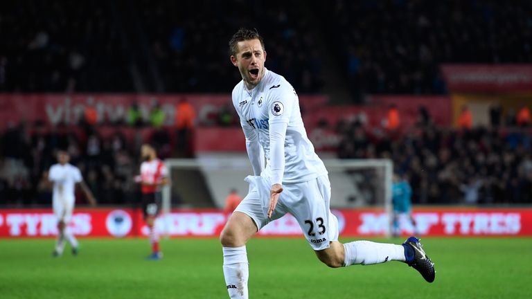 SWANSEA, WALES - JANUARY 31:  Gylfi Sigurdsson of Swansea City celebrates scoring his sides second goal during the Premier League match between Swansea Cit