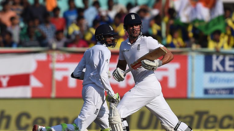 England's captain Alastair Cook (R) and Haseeb Hameed run between the wickets during the fourth day of the second Test cricket match between India and Engl