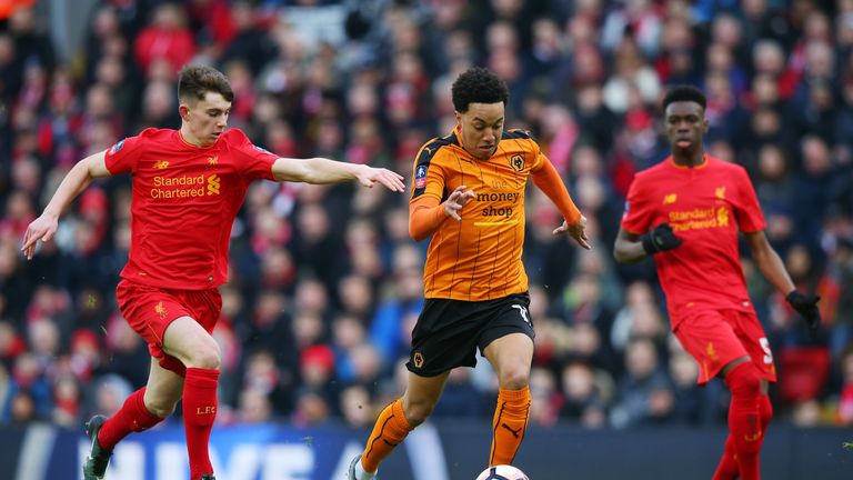 Helder Costa of Wolves takes on Ben Woodburn of Liverpool