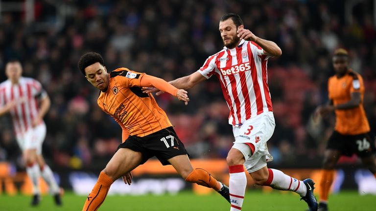 STOKE ON TRENT, ENGLAND - JANUARY 07: Helder Costa of Wolverhampton Wanderers and Erik Pieters of Stoke City compete for the ball during The Emirates FA Cu