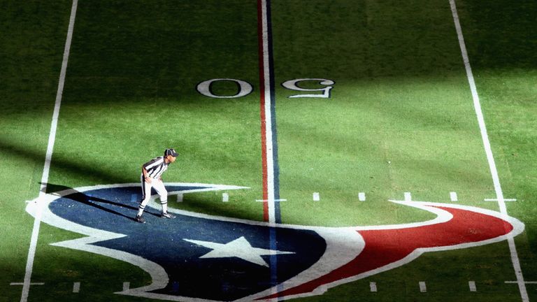HOUSTON, TX - JANUARY 07:  A referee is seen standing on a Houston Texans logo while the Texans host the Cincinnati Bengals during their 2012 AFC Wild Card