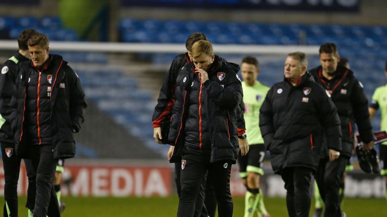 Bournemouth's English manager Eddie Howe (C) leaves the pitch after seeing his team lose 3-0 in the English FA Cup third round football match between Millw