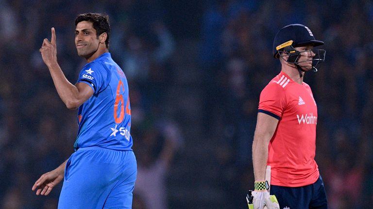India's Ashish Nehra (L) celebrates after the dismissal of England's Sam Billings during the second T20I