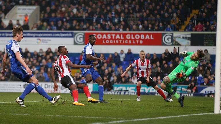 Theo Robinson of Lincoln City scores his side's first goal during the Emirates FA Cup third round match between Ipswich and Lincoln