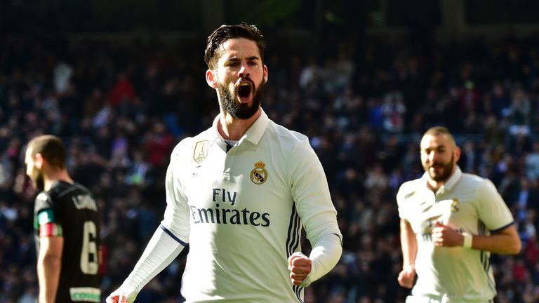 Real Madrid's midfielder Isco celebrates after scoring during the Spanish league football match Real Madrid CF vs Granada FC at the Santiago Bernabeu stadi