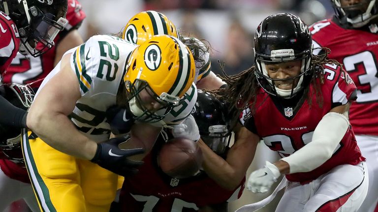 ATLANTA, GA - JANUARY 22: Aaron Ripkowski #22 of the Green Bay Packers fumbles the ball in the second quarter after contact with Jalen Collins #32 of the A