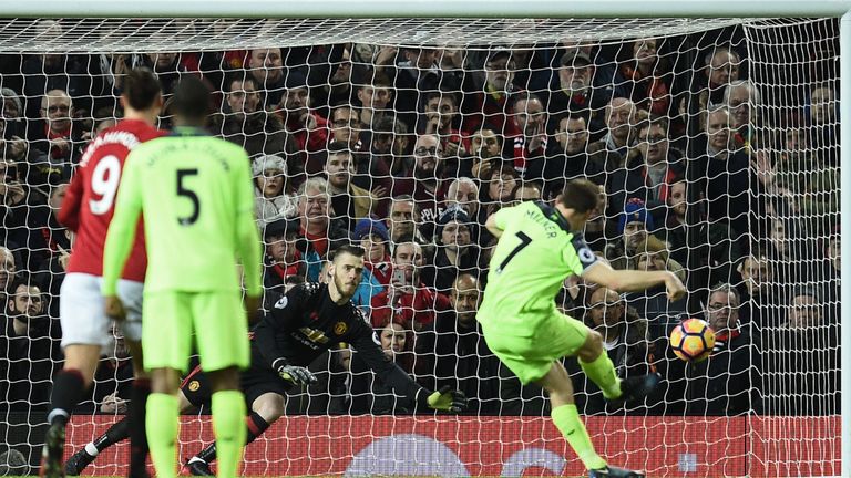 James Milner strikes his penalty in to the corner of David de Gea's goal