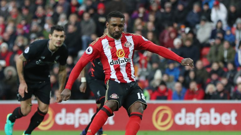 Jermain Defoe scores from the penalty spot against Liverpool