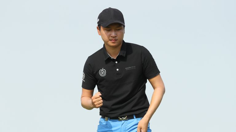 DOHA, QATAR - JANUARY 29:  Jeunghun Wang of South Korea celebrates after saving par on the fifth hole during the fourth round of the Commercial Bank Qatar 