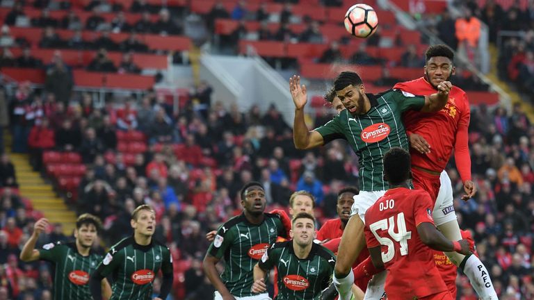 Liverpool's English defender Joe Gomez (R) jumps against Plymouth's English striker Jake Jervis to head the ball during the English FA Cup third round foot