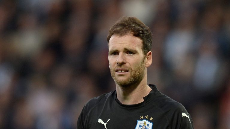 Huddersfield Town goalkeeper Joe Murphy has joined Bury on loan until the end of the season
