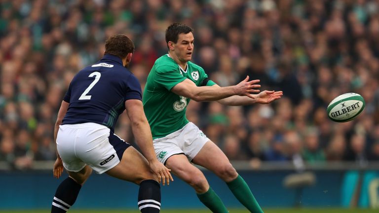 DUBLIN, IRELAND - MARCH 19:  Jonathan Sexton of Ireland passes the ball as Ross Ford of Scotland closes in during the RBS Six Nations match between Ireland