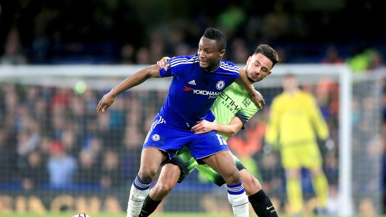 Jon Obi Mikel holds off David Faupala during the Emirates FA Cup, fifth round match at Stamford Bridge