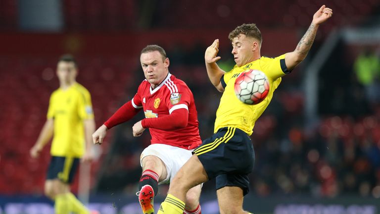 Manchester United's Wayne Rooney shoots past Middlesbrough's Jonny Burn during the Barclays Under-21 Premier League match at Old Traffford, Manchester.