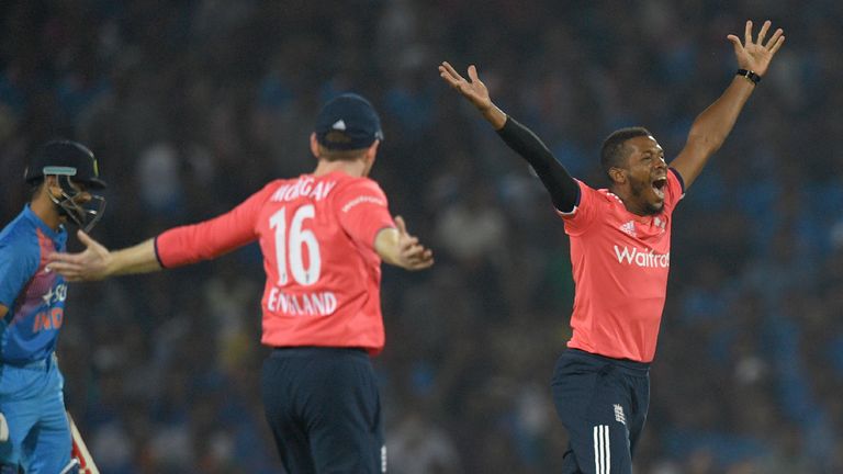 England's captain Eoin Morgan (C) and Chris Jordan (R) appeals unsuccessfully against India's captain Virat Kohli during the second T20 match between India