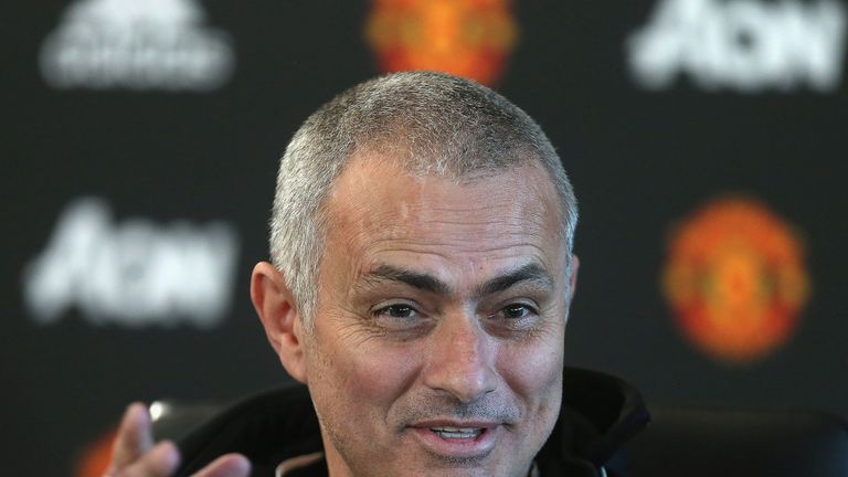 Jose Mourinho, sporting a new haircut, speaks during a press conference at Aon Training Complex