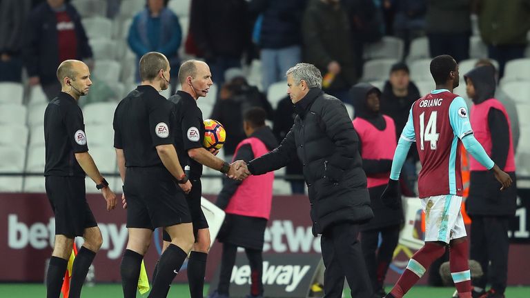 Jose Mourinho shakes hands with referee Mike Dean after the final whistle at London Stadium