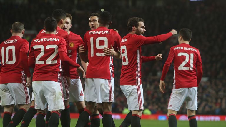 United's players celebrate with Juan Mata after he put the home side ahead against Hull