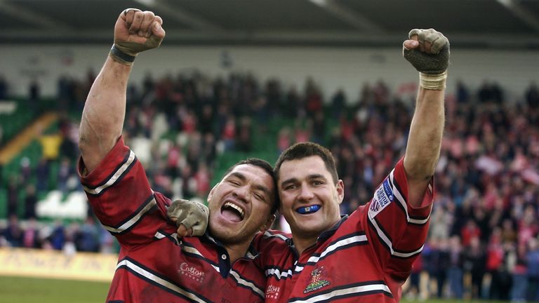 Junior Paramore and Thinus Delport of Gloucester celebrate victory in the Powergen Cup semi-final match between Leicester and Gloucester March 1 2003