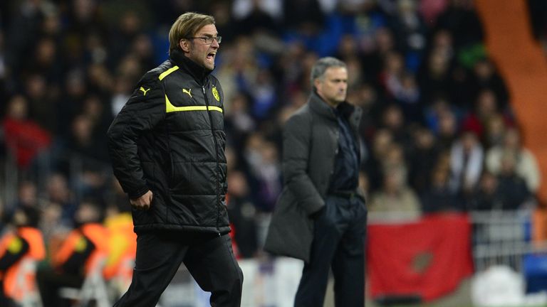Borussia Dortmund's head coach Juergen Klopp (L) reacts close to Real Madrid's Portuguese coach Jose Mourinho (R) during the UEFA Champions League football