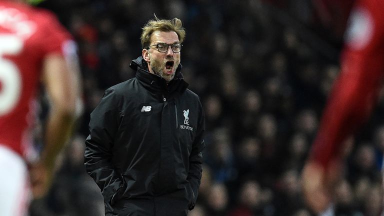 Jurgen Klopp shouts instructions to his players from the touchline