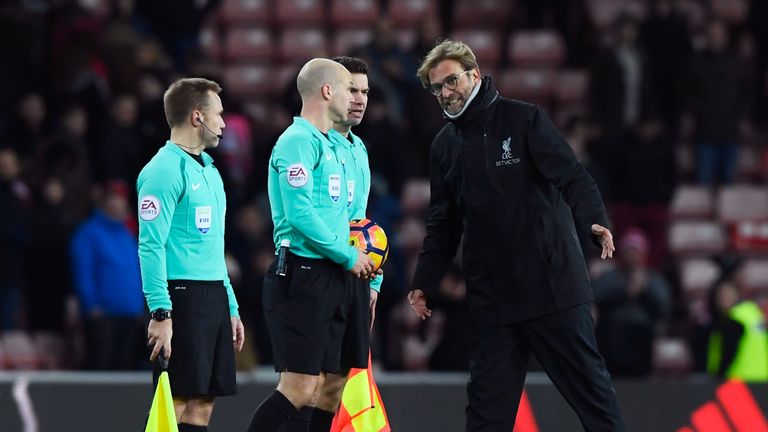 Referee Anthony Taylor speaks to Jurgen Klopp, Manager of Liverpool after the Premier League match between Sunderland