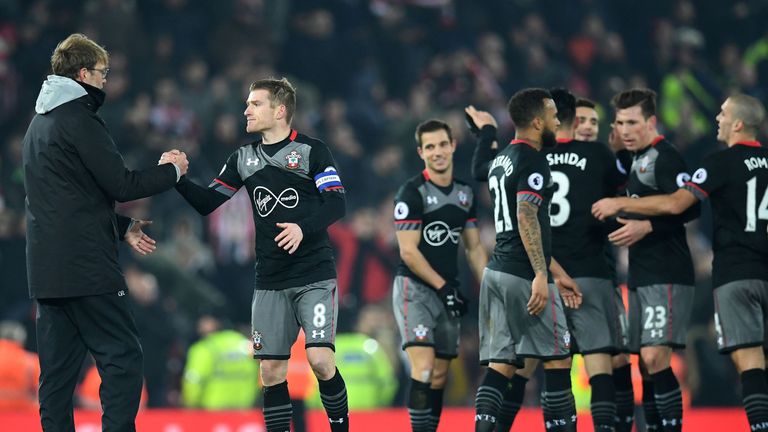 Jurgen Klopp (L) congratulates Southampton's Steven Davis following the EFL Cup tie v Liverpool at Anfield