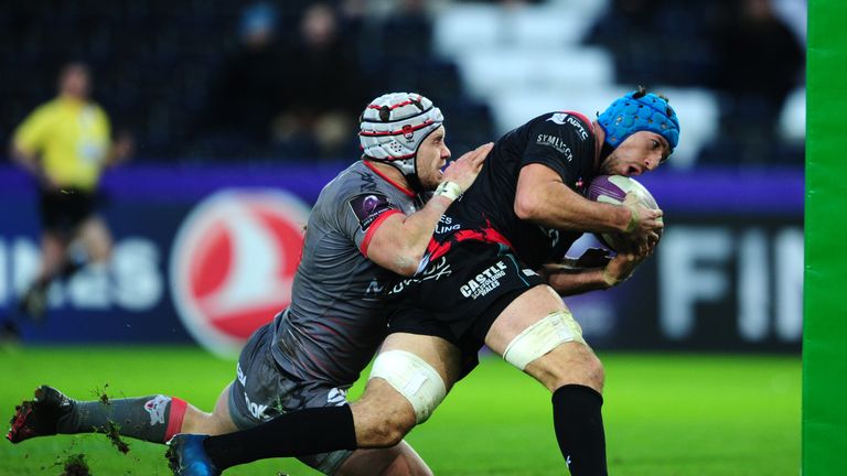 Justin Tipuric of Ospreys catches and collects the ball to go over for a try