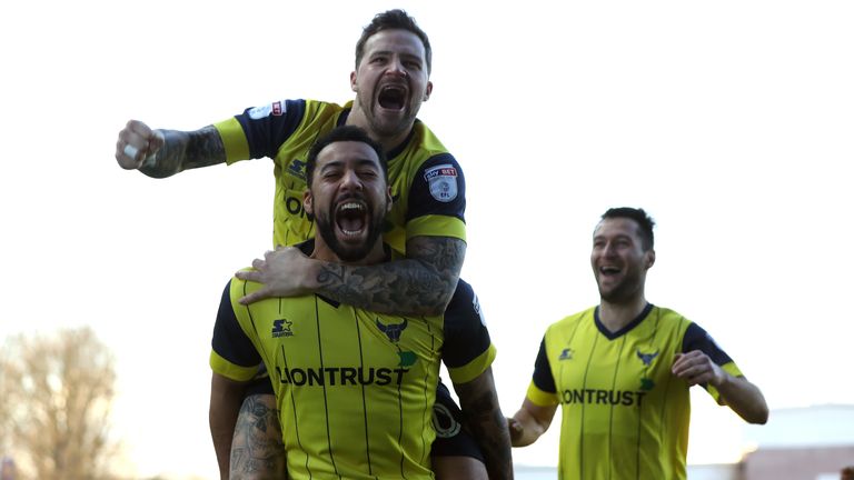 Kane Hemmings (bottom) of Oxford United celebrates scoring the opening goal against Newcastle with his team mate Chris Maguire 
